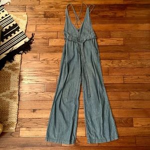 Free People denim jumpsuit / size 2 / looser fit / bell bottom flare